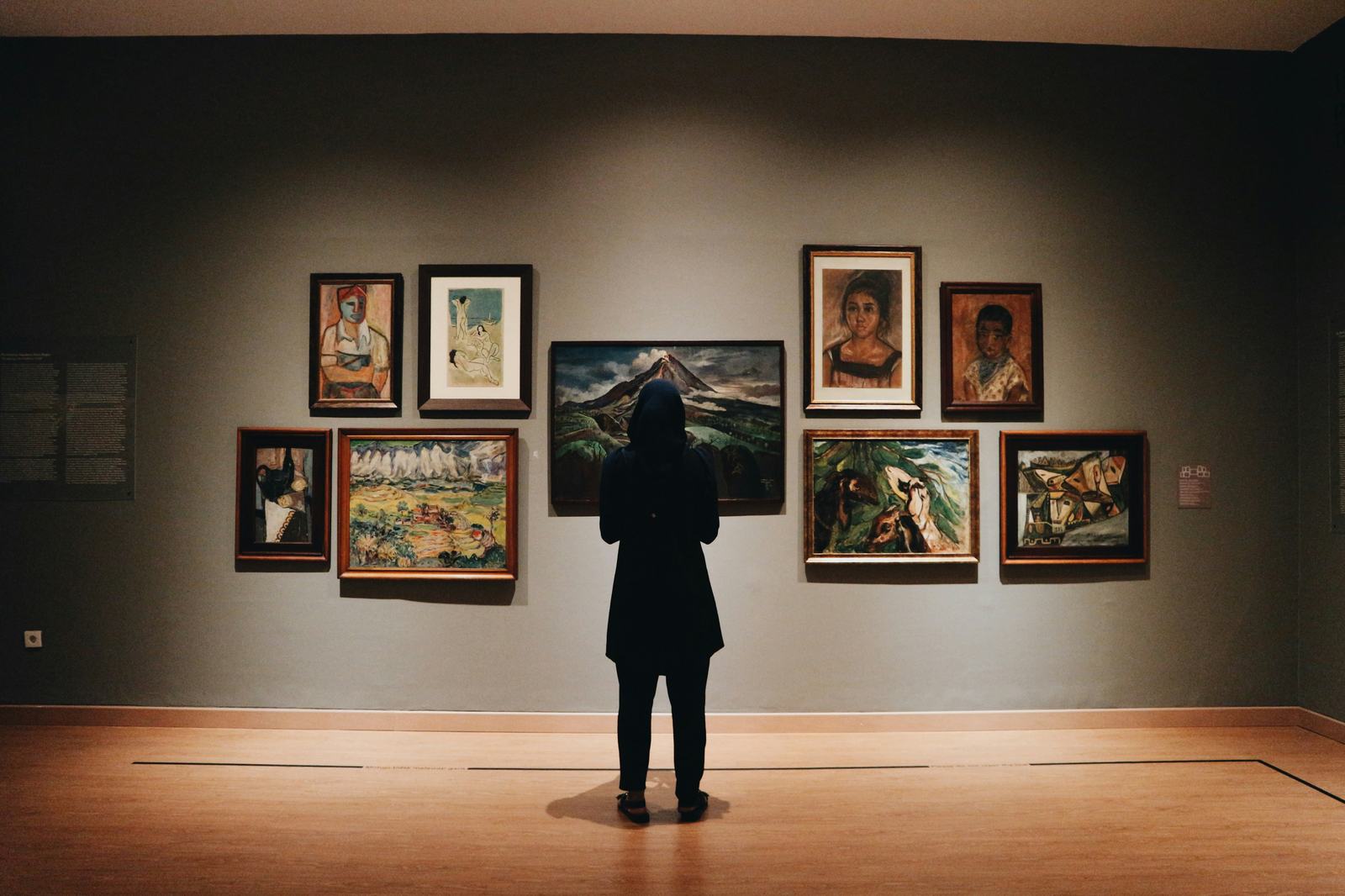 Quiet museum gallery with framed works