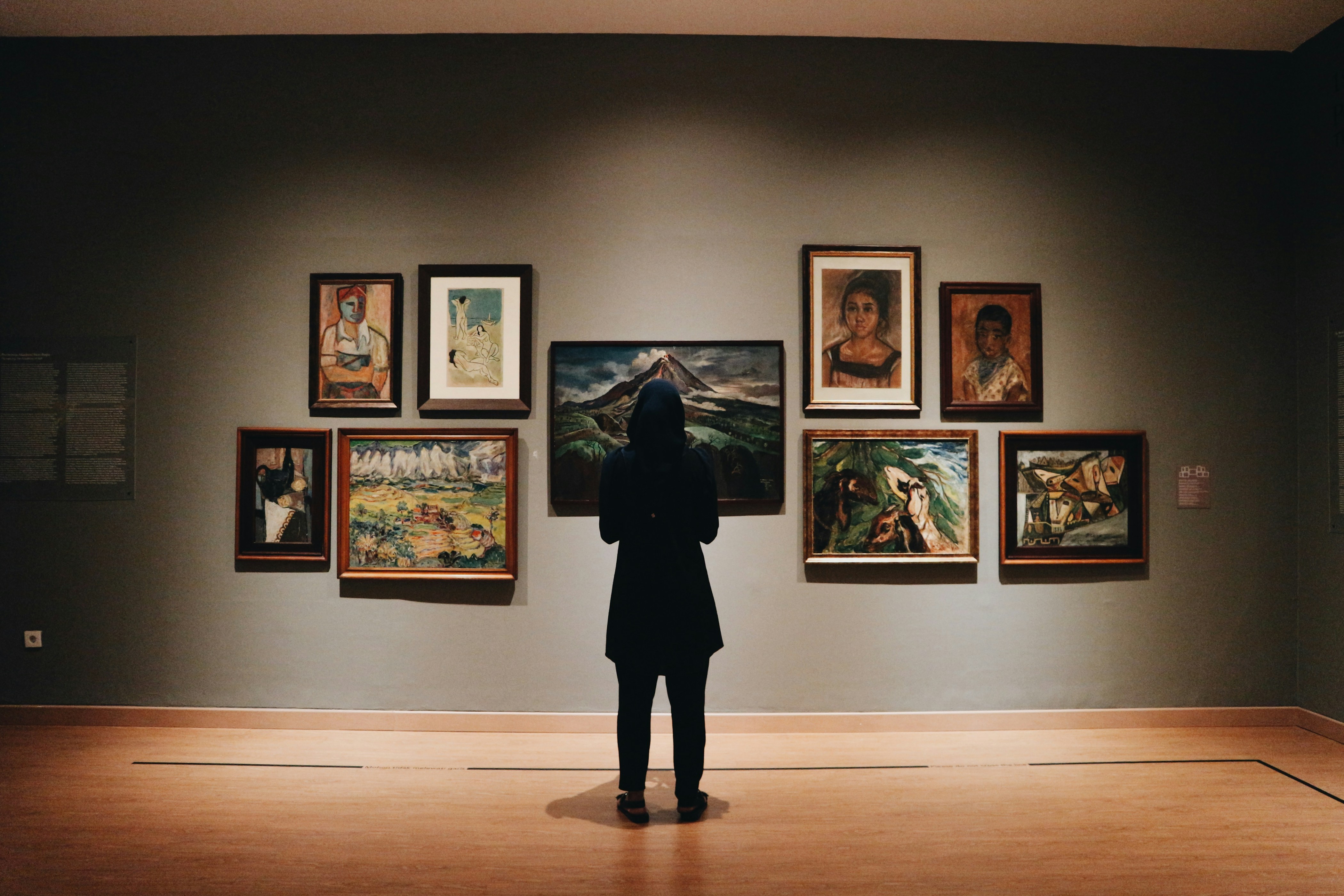 Quiet museum gallery with framed works