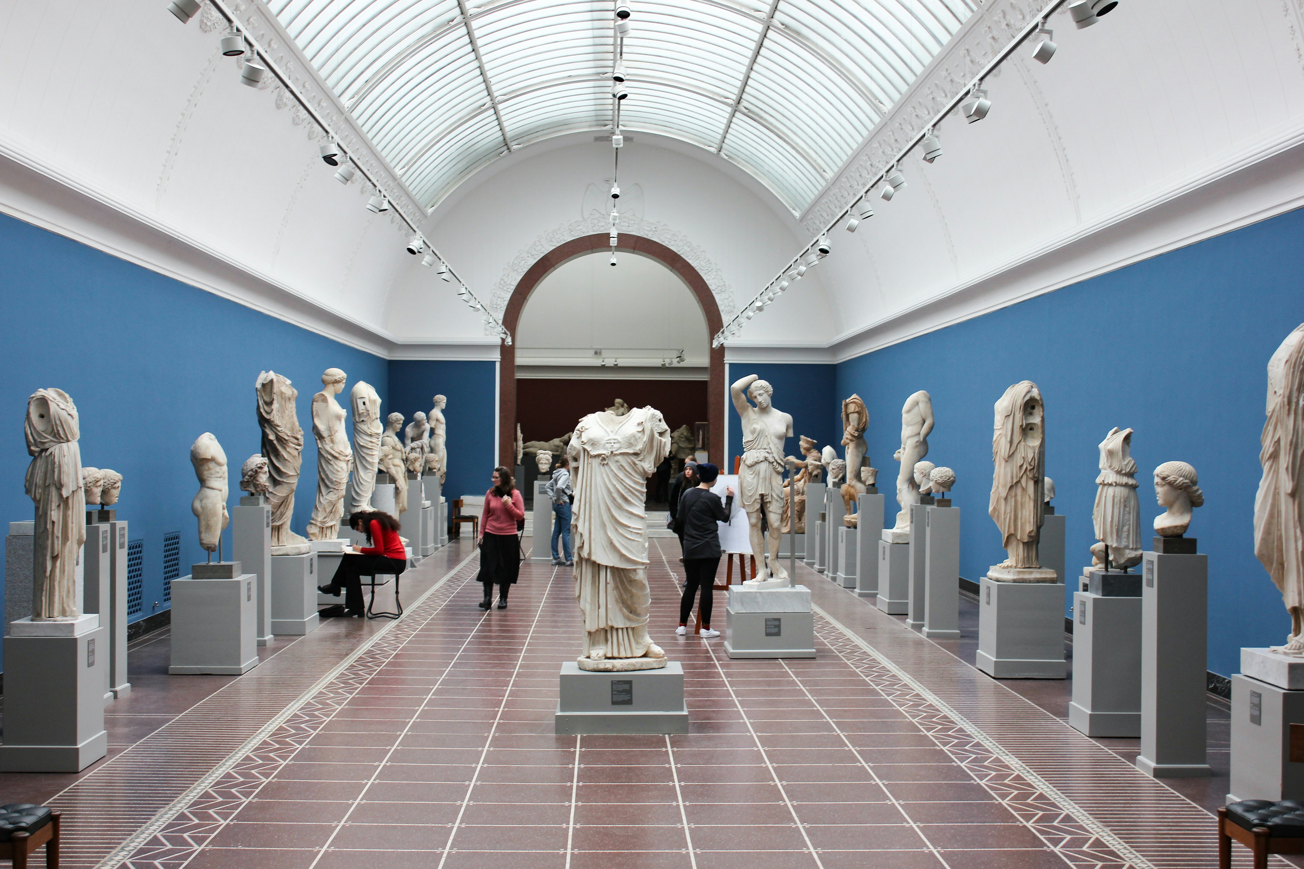 Museum sculpture hall with visitors